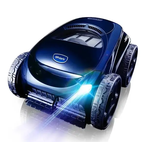 A dark blue Polaris robotic pool cleaner with four-wheel drive. A bright white light emanates from a headlight on its front, and the Polaris logo is prominently displayed on the top casing.